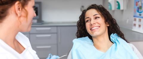 Smiling woman at dentist