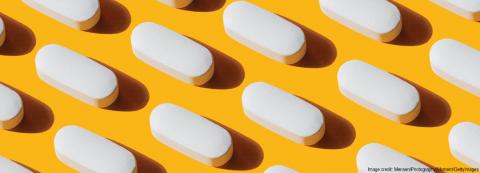 image of neatly organized pills on yellow background