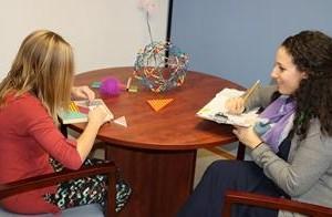 Child participating in game therapy with CAYAC therapist